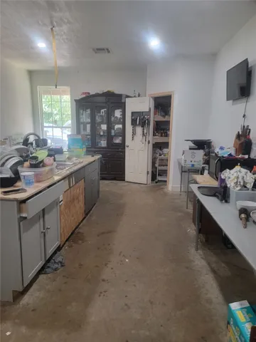 a kitchen with stainless steel appliances granite countertop a sink and cabinets