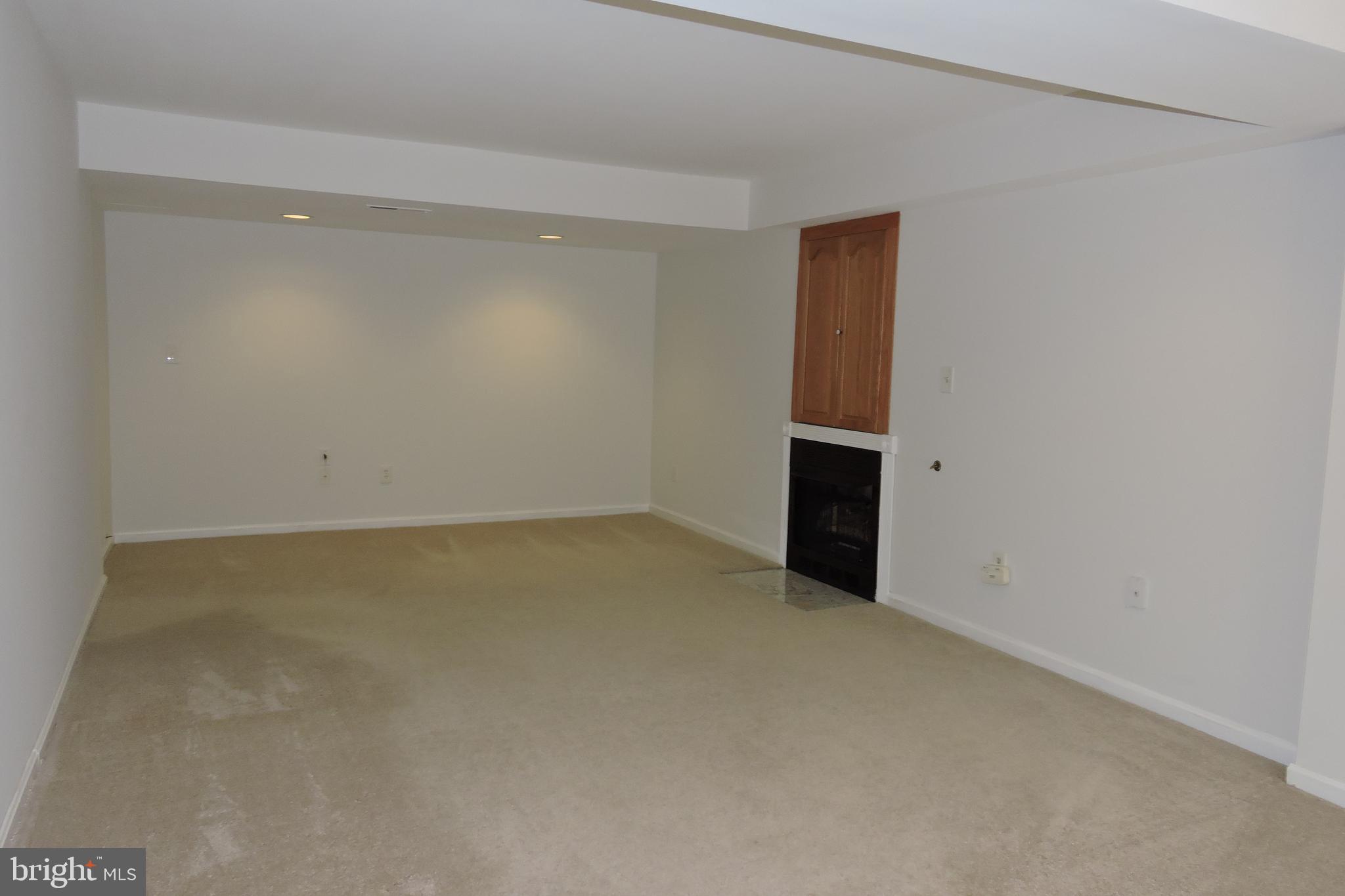 7214 Countrywood Court Springfield, VA 22151 - Photo 9 of 21 Living Room with Gas fireplace