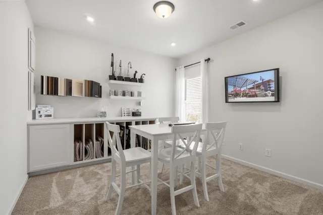 a view of a dining room with furniture