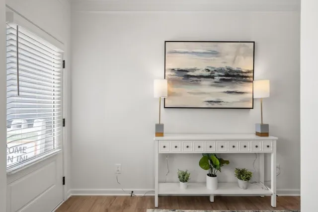 a shelf with painting and table