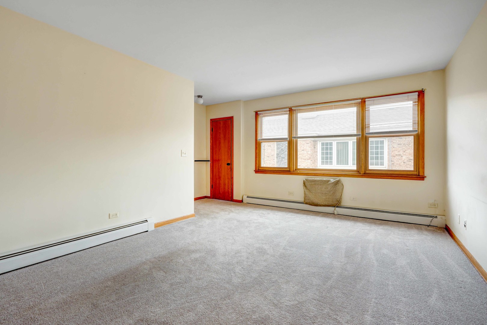 8444 West Gregory Street, Unit 3B Chicago, IL 60656 - Photo 4 of 9 an empty room with a empty space and windows