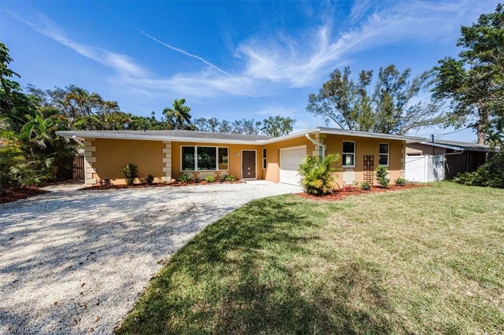 front view of a house with a big yard