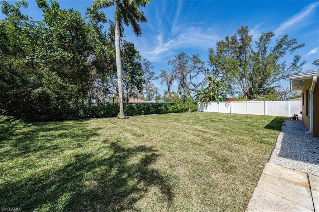 2545 Dawn Circle Naples, FL 34103 - Photo 18 of 20 a view of backyard with green space