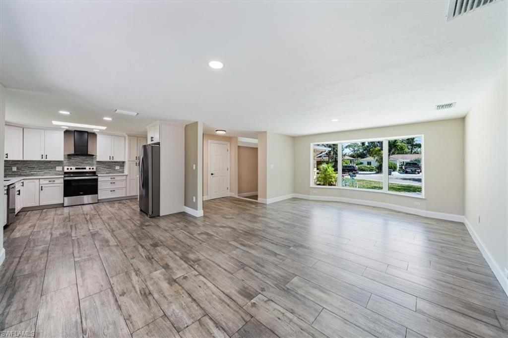 2545 Dawn Circle Naples, FL 34103 - Photo 2 of 20 a view of a kitchen with a sink and a stove top oven