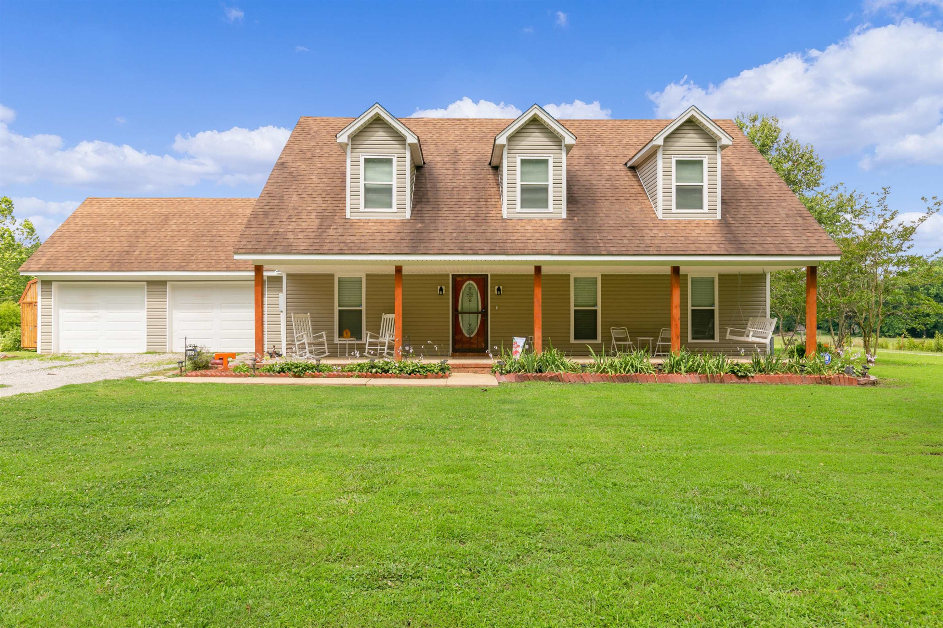 3225 Pickens Store Road Mason, TN 38049 - Photo 1 of 32 a front view of a house with swimming pool having outdoor seating