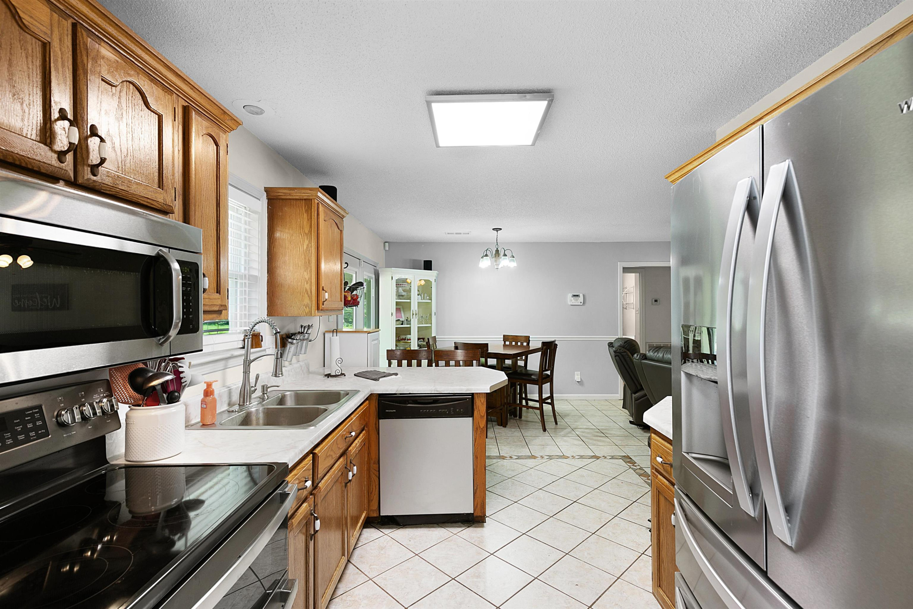 3225 Pickens Store Road Mason, TN 38049 - Photo 12 of 32 a kitchen with a sink appliances and cabinets