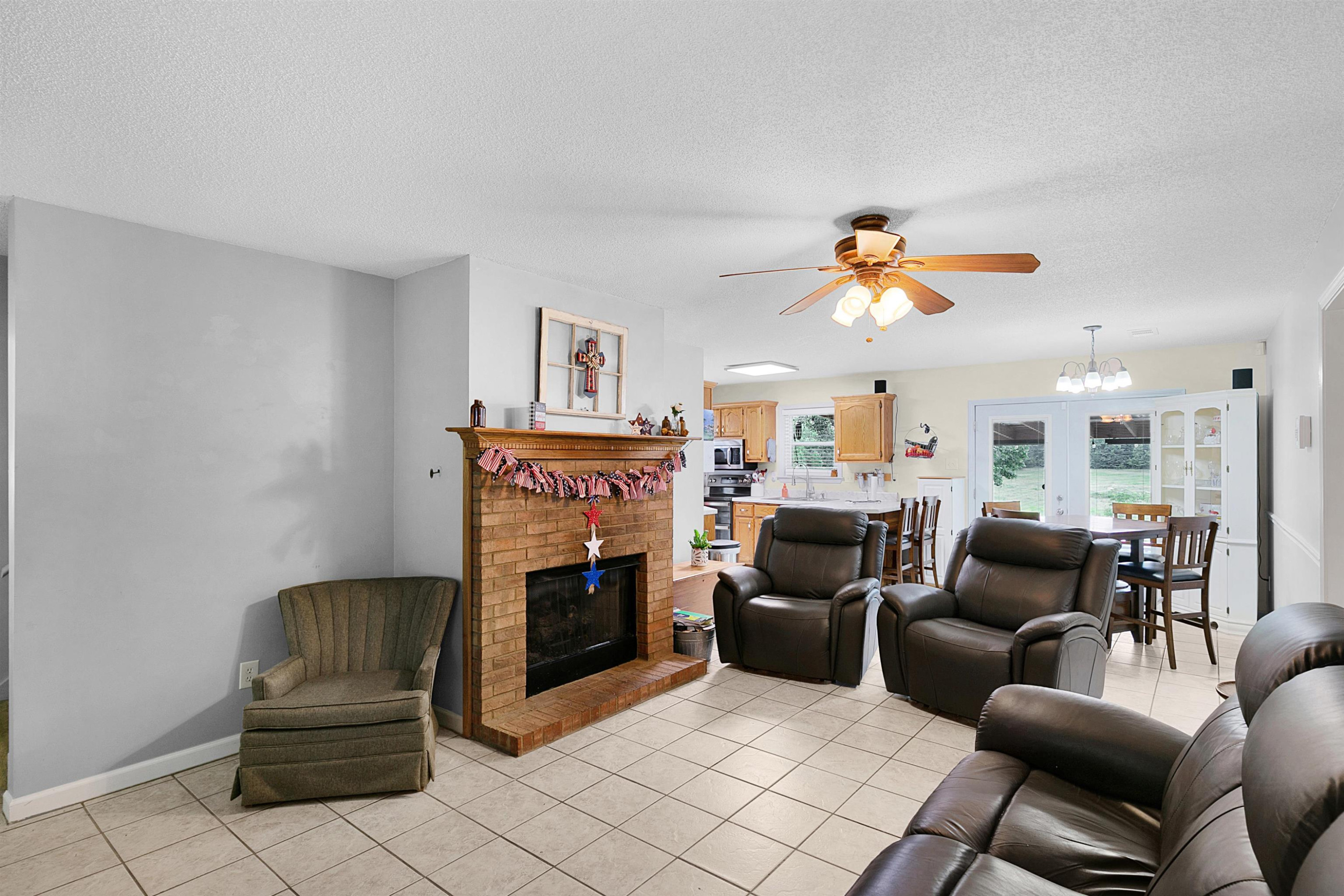 3225 Pickens Store Road Mason, TN 38049 - Photo 20 of 32 a living room with furniture fireplace and flat screen tv