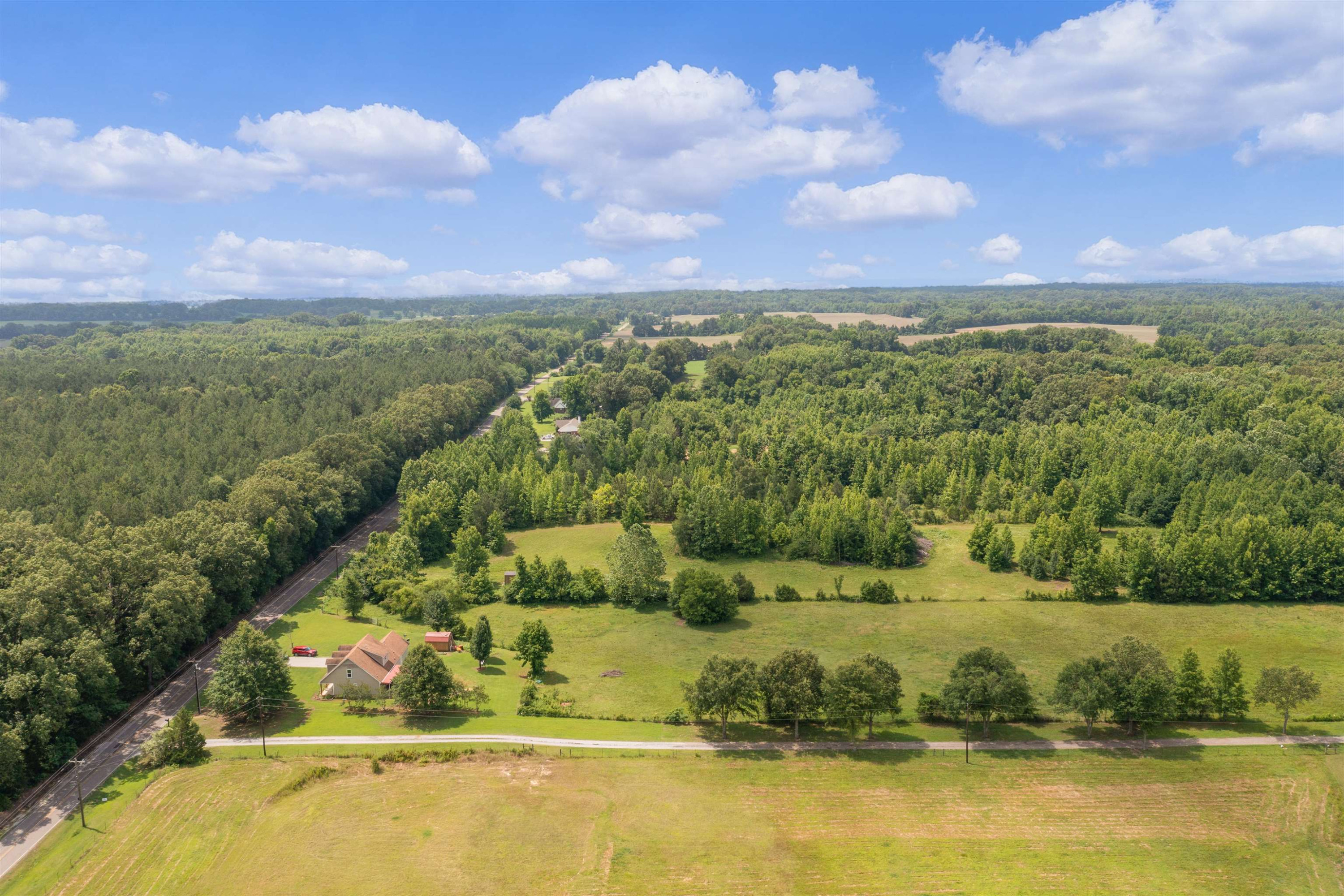 3225 Pickens Store Road Mason, TN 38049 - Photo 23 of 32 a view of a lake with houses in the back