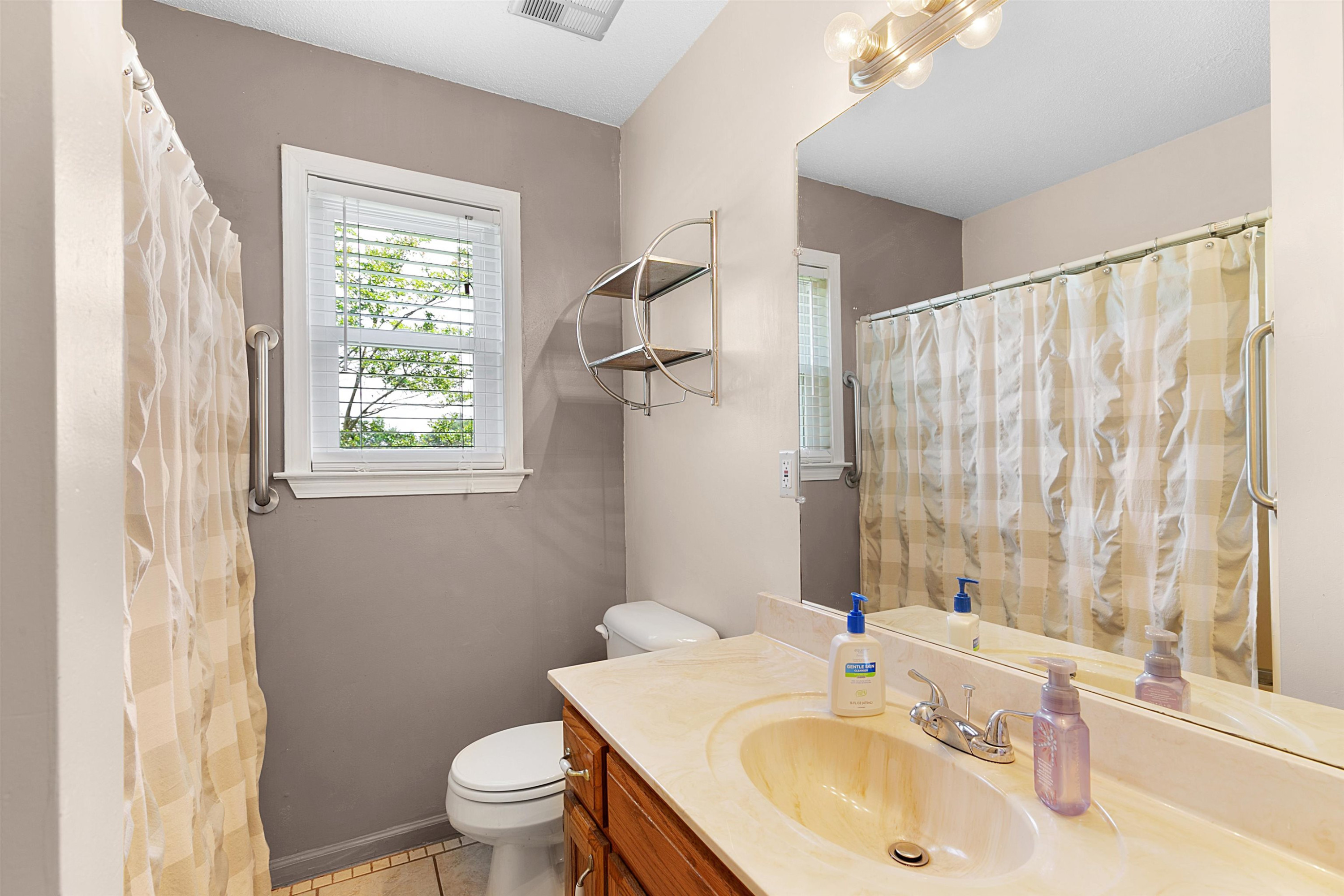 3225 Pickens Store Road Mason, TN 38049 - Photo 7 of 32 a bathroom with a sink toilet and shower