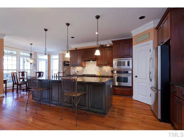 4216 Oakthorne Way Raleigh, NC 27613 - Photo 8 of 24 It is all about the kitchen and this home has a great one! Huge center island, stainless appliances, gas cook top, and large pantry. Opens to family room for easy entertaining! Kitchen
