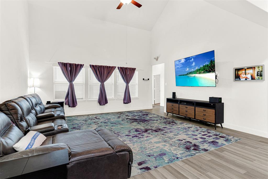 817 Amy Boulevard Anna, TX 75409 - Photo 12 of 40 a living room with furniture and a rug