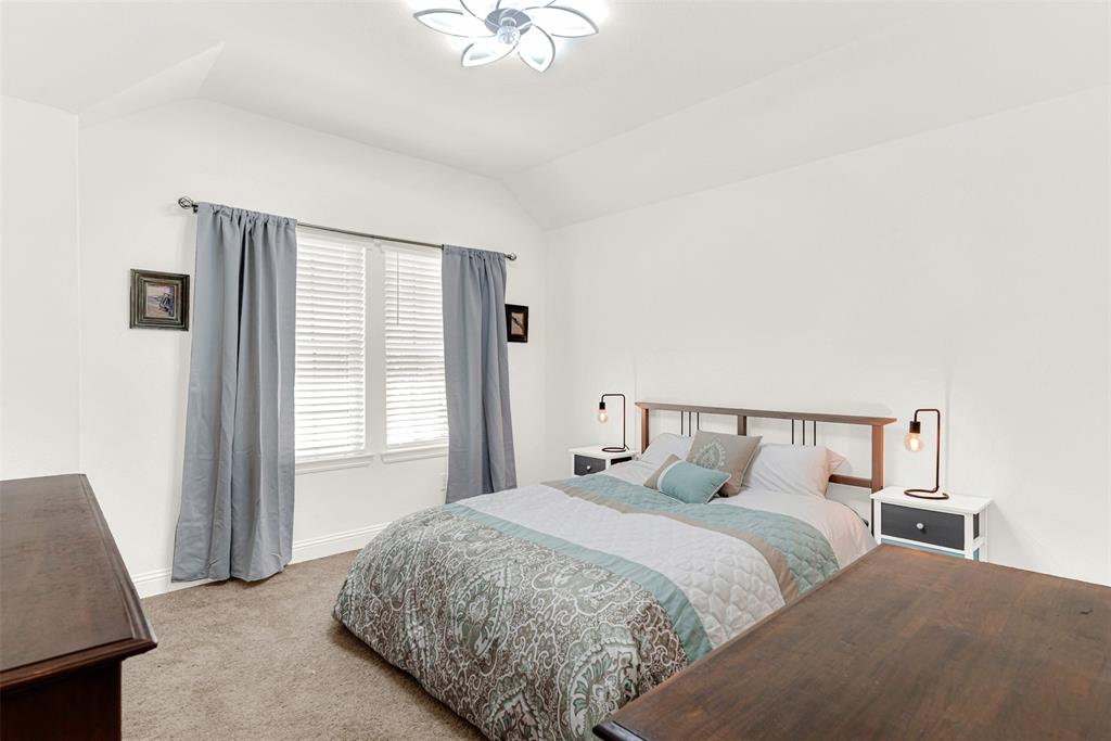 817 Amy Boulevard Anna, TX 75409 - Photo 23 of 40 a bedroom with a bed and a window