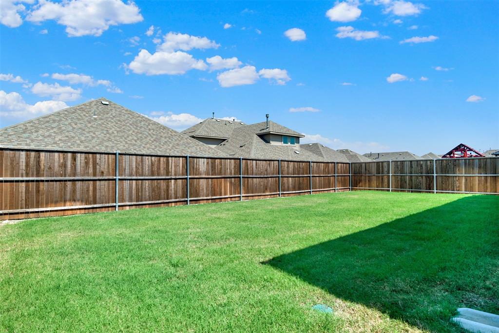 817 Amy Boulevard Anna, TX 75409 - Photo 33 of 40 a view of a backyard with a garden