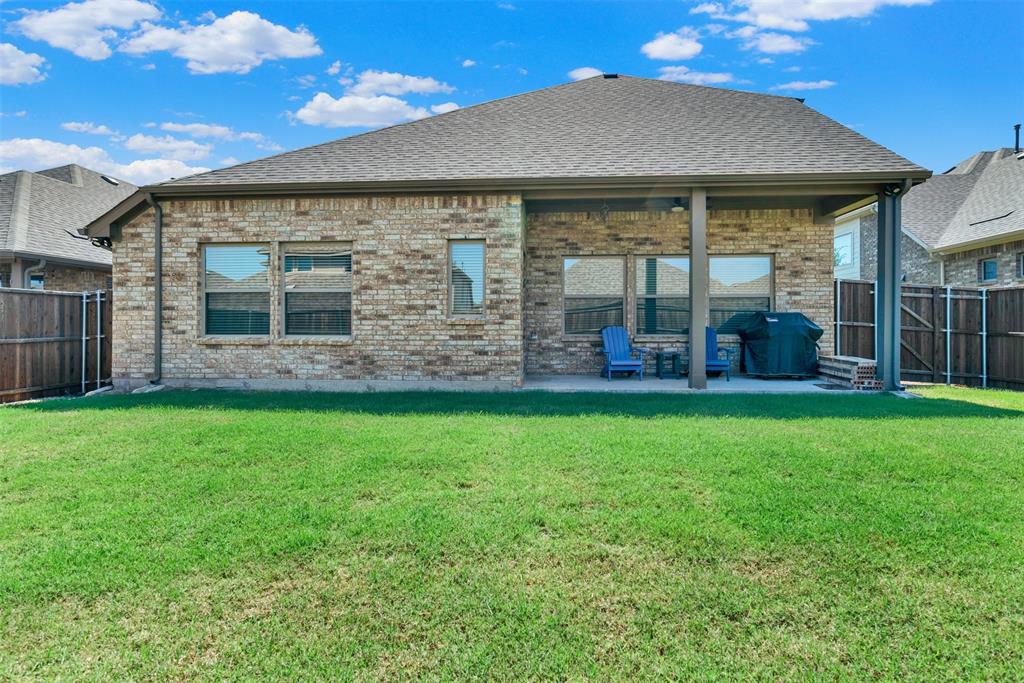 817 Amy Boulevard Anna, TX 75409 - Photo 35 of 40 a front view of a house with garden