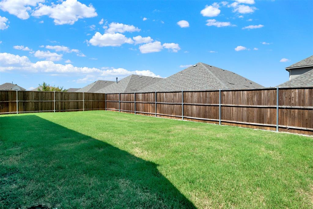 817 Amy Boulevard Anna, TX 75409 - Photo 37 of 40 a view of a backyard with a garden