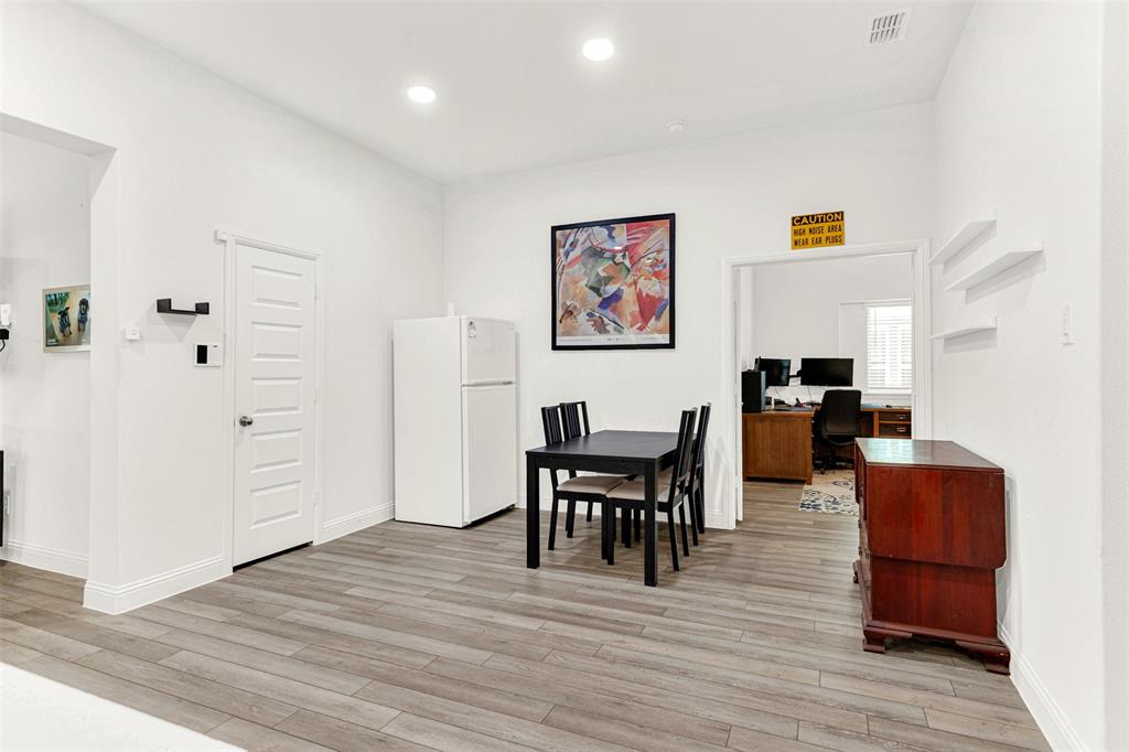817 Amy Boulevard Anna, TX 75409 - Photo 6 of 40 a view of a dining room with furniture and wooden floor