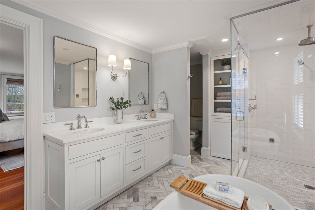56 Pine Ridge Road Newton, MA 02468 - Photo 11 of 24 a bathroom with a double vanity sink mirror and shower