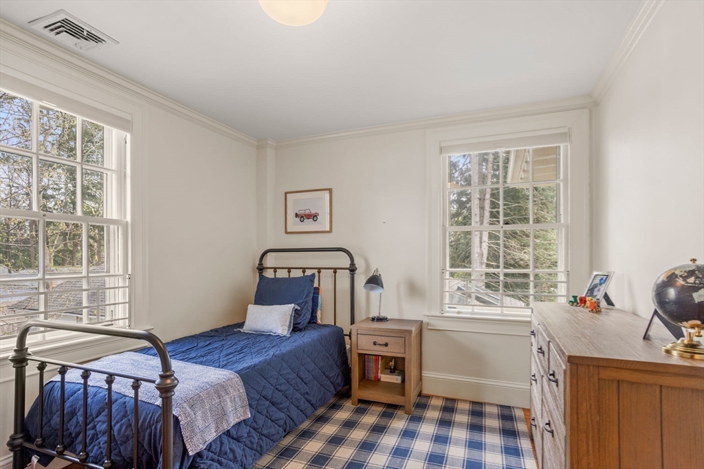 56 Pine Ridge Road Newton, MA 02468 - Photo 14 of 24 a bedroom with a bed and windows