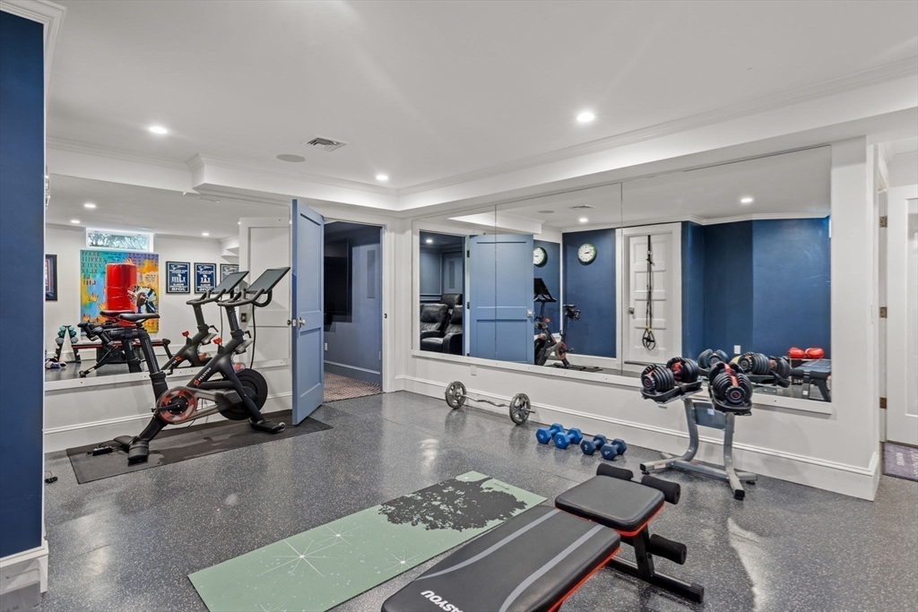 56 Pine Ridge Road Newton, MA 02468 - Photo 18 of 24 a living room with furniture and gym equipment