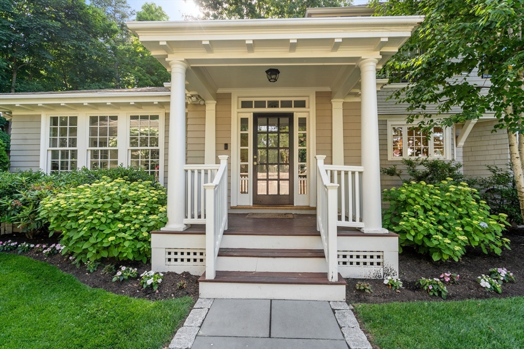 56 Pine Ridge Road Newton, MA 02468 - Photo 2 of 24 a front view of a house with a garden