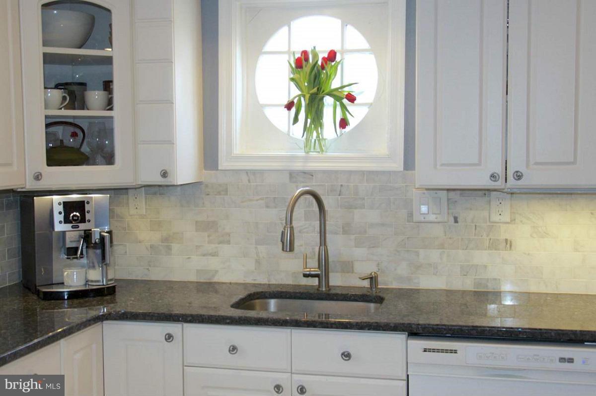 525 Windwood Road Baltimore, MD 21212 - Photo 3 of 6 a kitchen with stainless steel appliances granite countertop white cabinets and a granite counter tops