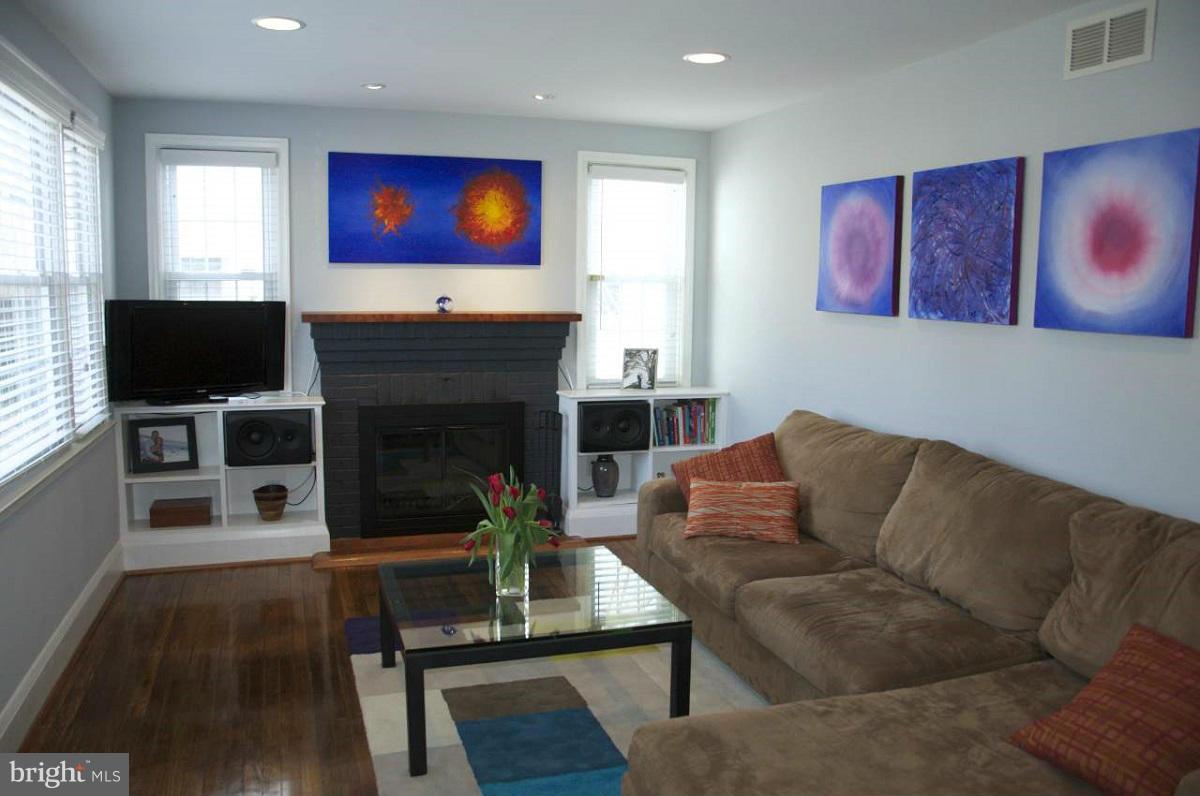 525 Windwood Road Baltimore, MD 21212 - Photo 4 of 6 a living room with furniture fireplace and flat screen tv