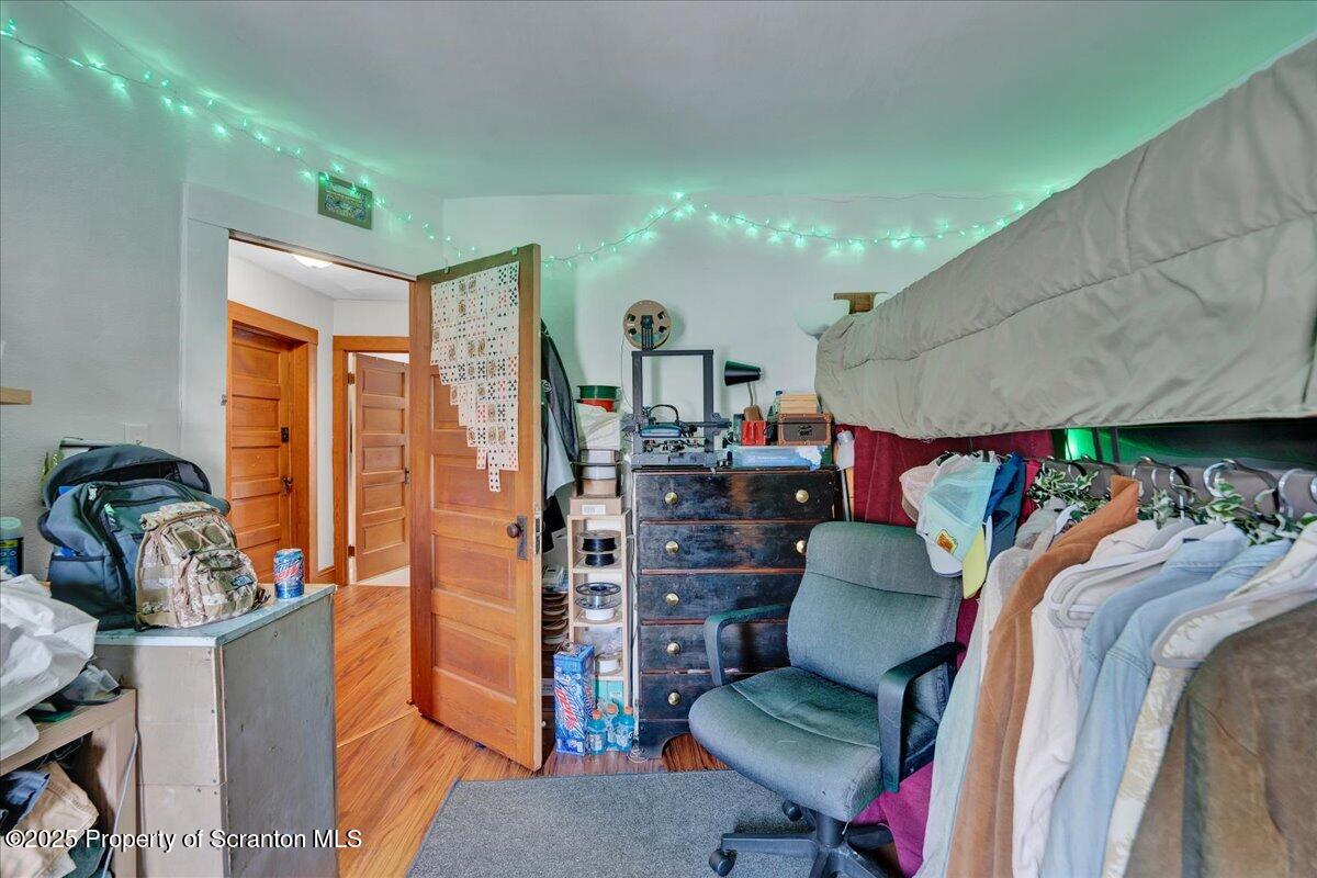 Undisclosed Address Scranton, PA 18509 - Photo 15 of 26 a living room with furniture and a wooden floor