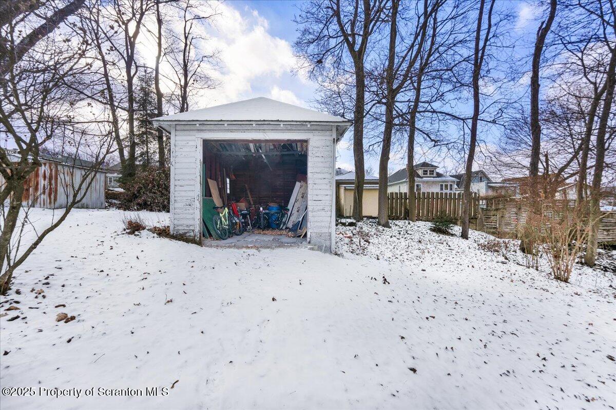 Undisclosed Address Scranton, PA 18509 - Photo 21 of 26 a view of a house with a yard covered in snow