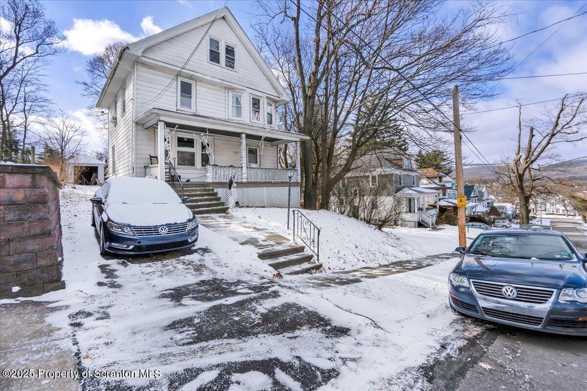 Undisclosed Address Scranton, PA 18509 - Photo 24 of 26 a view of a car parked in front of a house