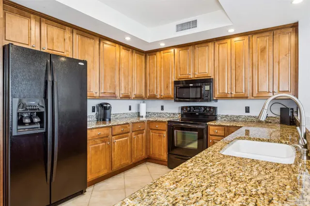 a bathroom with a tub a sink and mirror
