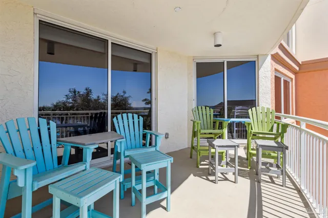 a view of a house with swimming pool next to a yard