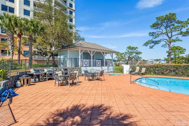 a view of a lake with couches chairs