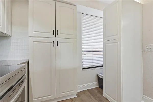 a view of hallway with wooden floor