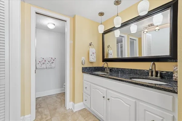 a bathroom with a toilet and a shower curtain