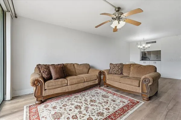 a living room with furniture and a rug