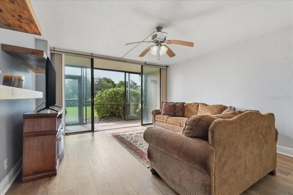 a living room with furniture and a large window