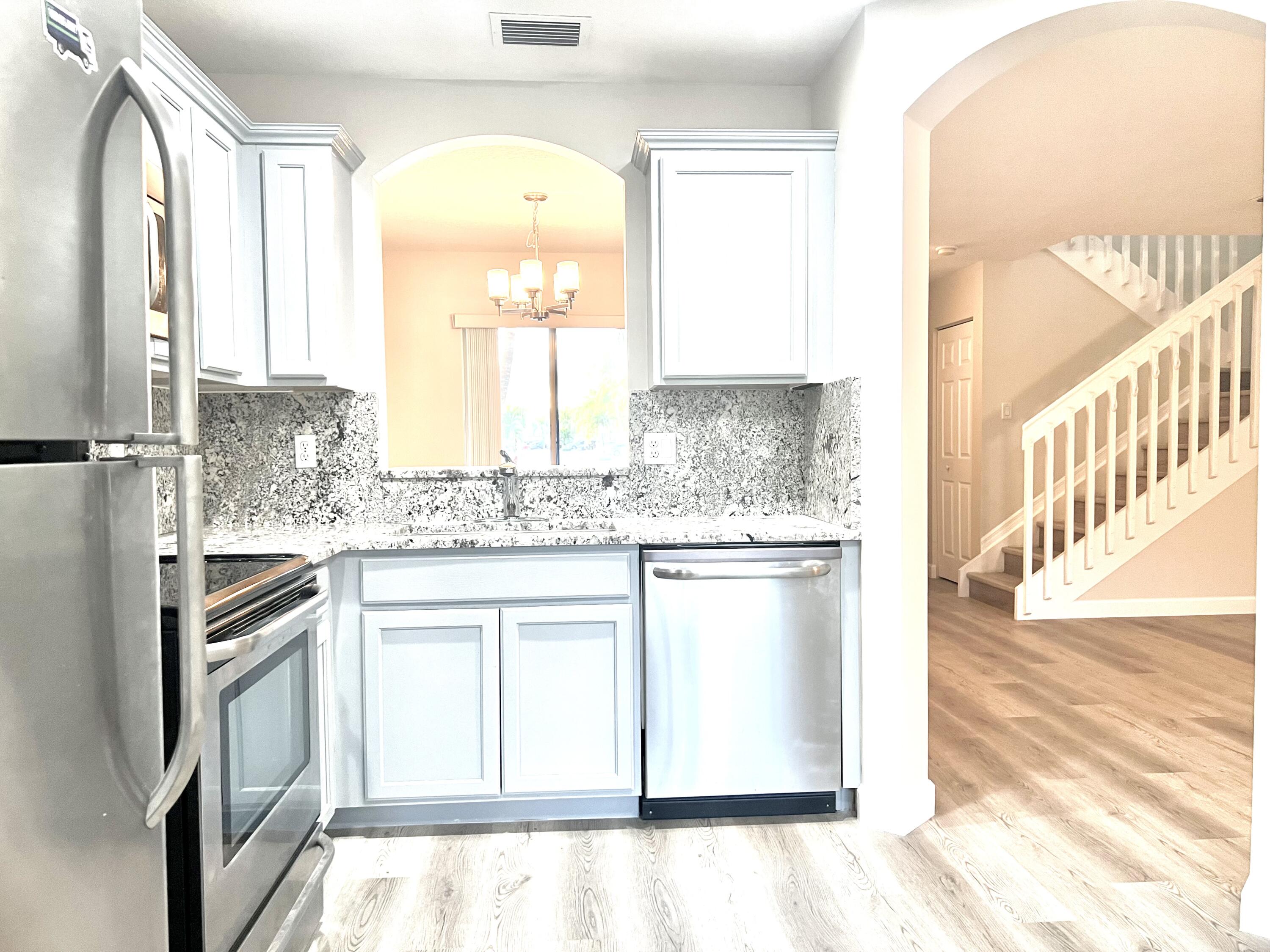 1041 Arezzo Circle Boynton Beach, FL 33436 - Photo 8 of 29 KITCHEN WITH STAINLESS STEEL APPLIANCES