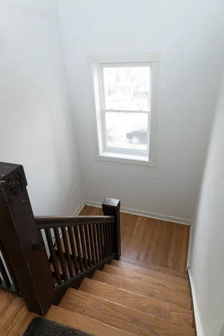 a view of balcony with wooden floor