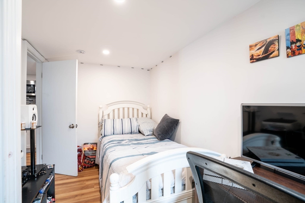 4 Fenley Street, Unit 1 Revere, MA 02151 - Photo 8 of 9 a bedroom with a bed and a window