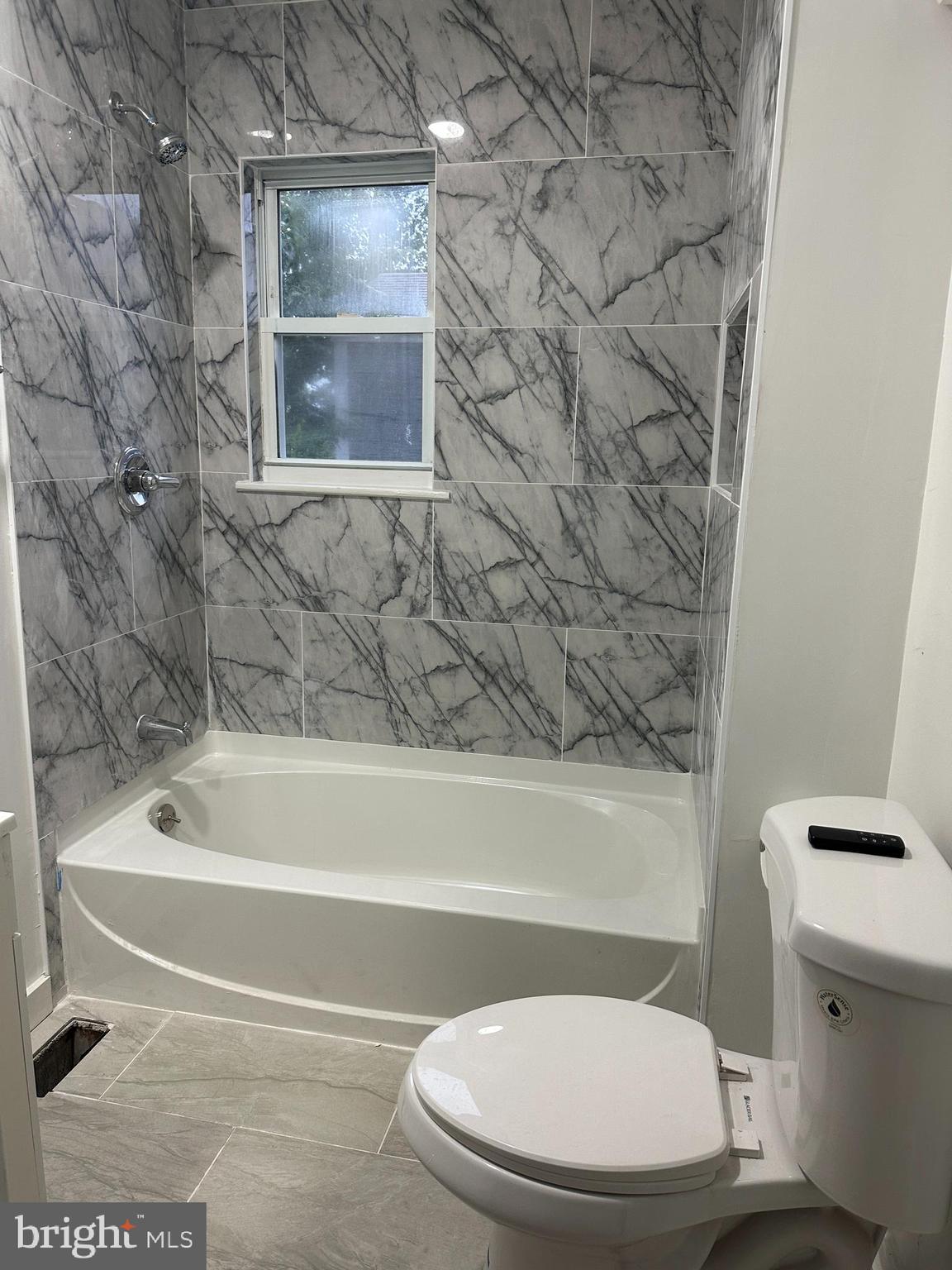 8411 11th Avenue Silver Spring, MD 20903 - Photo 8 of 24 a bathroom with a toilet and a bathtub