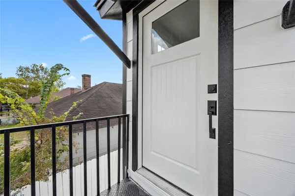 a balcony with view of outdoor space
