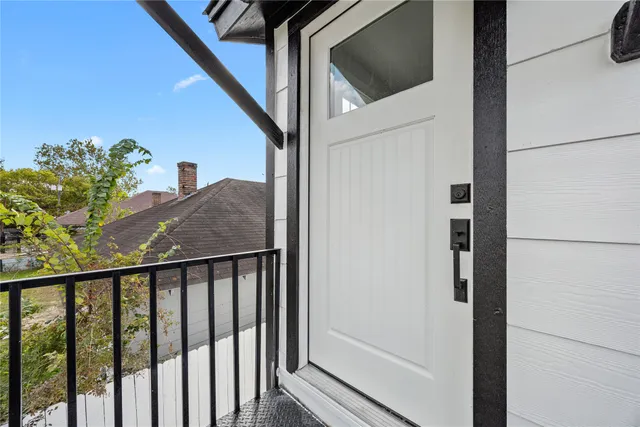 a balcony with view of outdoor space
