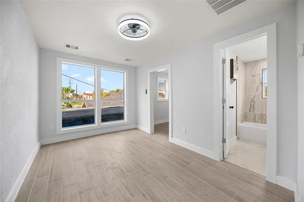 a view of an empty room with a window