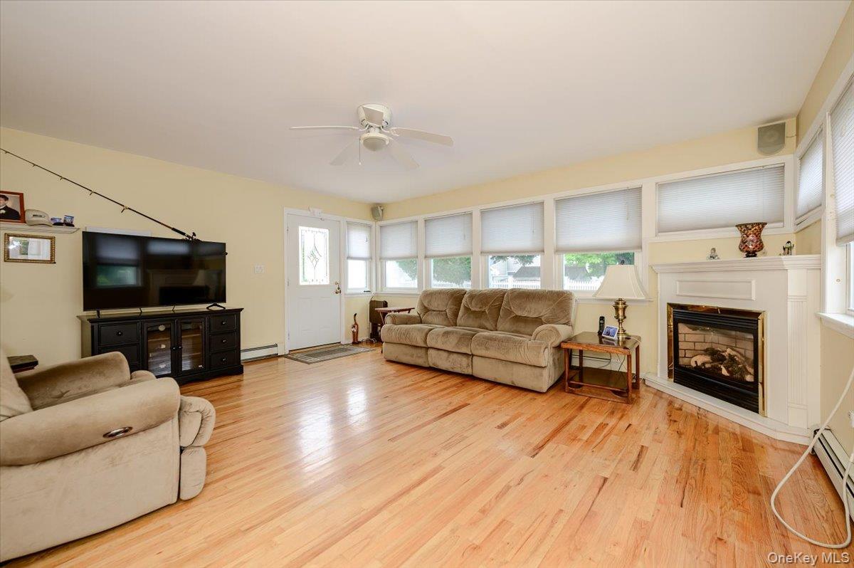 1815 Meadowbrook Road Merrick, NY 11566 - Photo 9 of 25 Gorgeous open den with gas fireplace