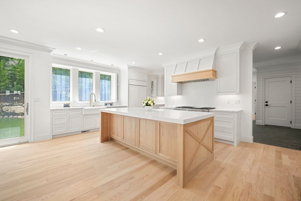 22 Suffolk Road Wellesley, MA 02481 - Photo 12 of 39 a kitchen with white cabinets and sink