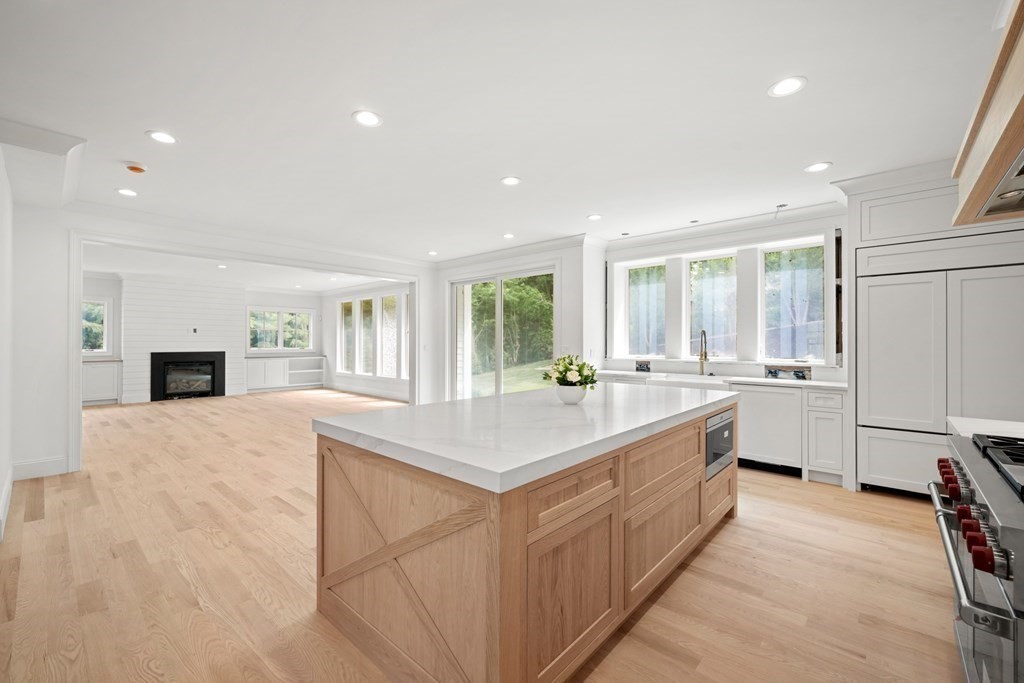 22 Suffolk Road Wellesley, MA 02481 - Photo 14 of 39 a large white kitchen with a stove a sink a refrigerator and a oven