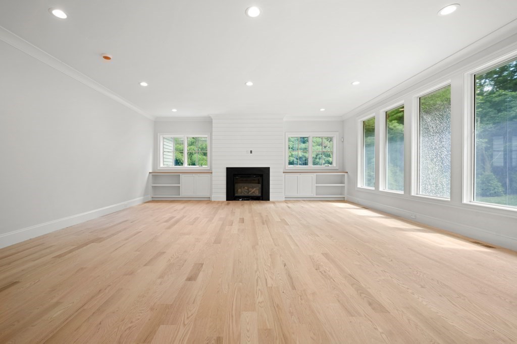 22 Suffolk Road Wellesley, MA 02481 - Photo 18 of 39 a view of empty room with a fireplace