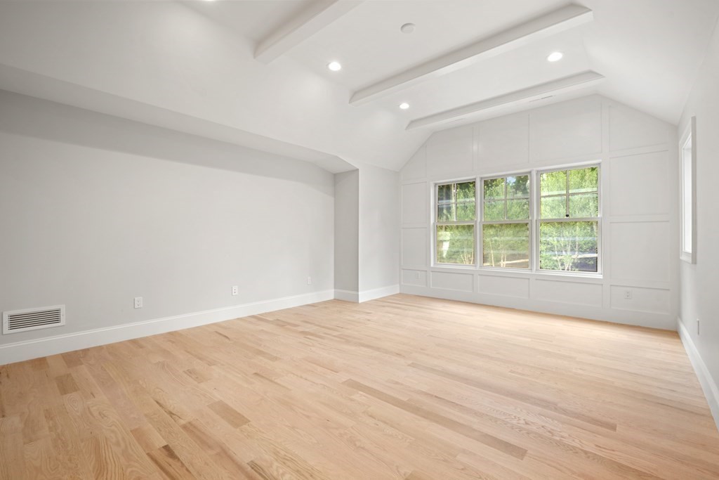 22 Suffolk Road Wellesley, MA 02481 - Photo 21 of 39 wooden floor in an empty room with a window