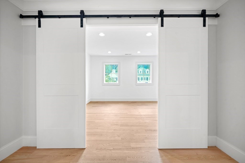 22 Suffolk Road Wellesley, MA 02481 - Photo 23 of 39 a view of a small space with wooden floor and a window