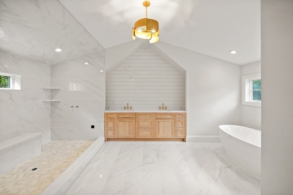 22 Suffolk Road Wellesley, MA 02481 - Photo 24 of 39 a bathroom with a sink a toilet and a shower